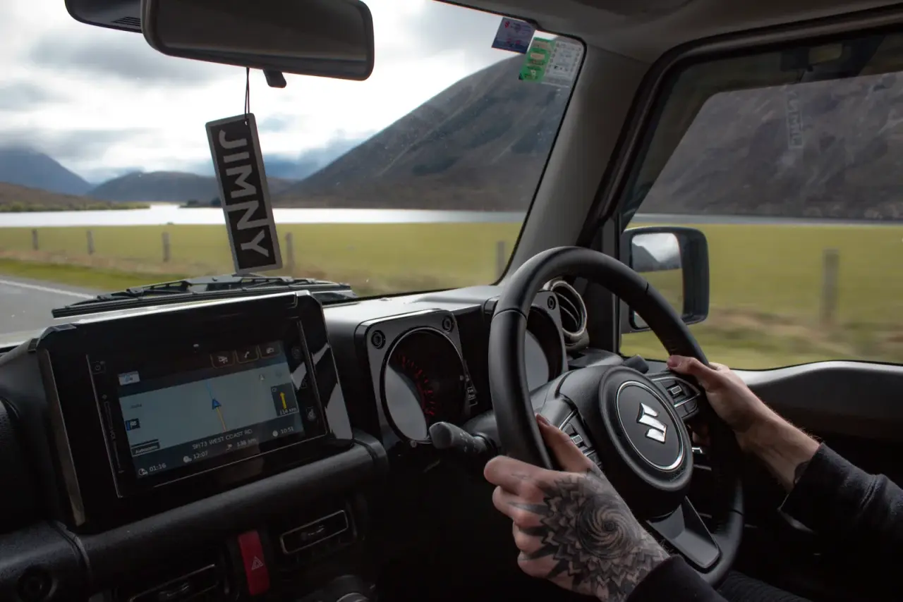 Suzuki Jimny in outdoor setting. – Jimny Rentals.