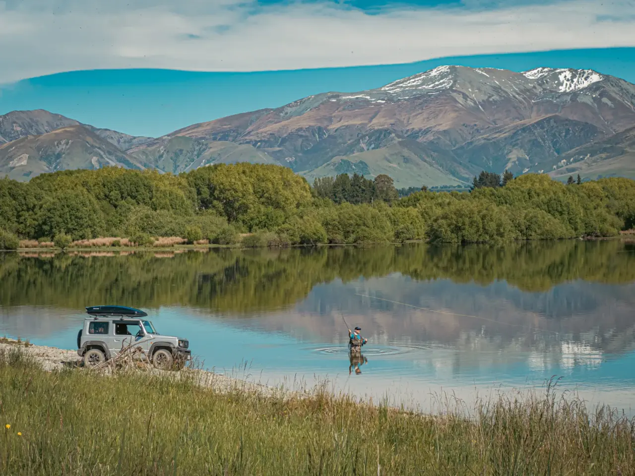 Suzuki Jimny with rooftop tent in scenic South Island location. – Jimny Rentals.